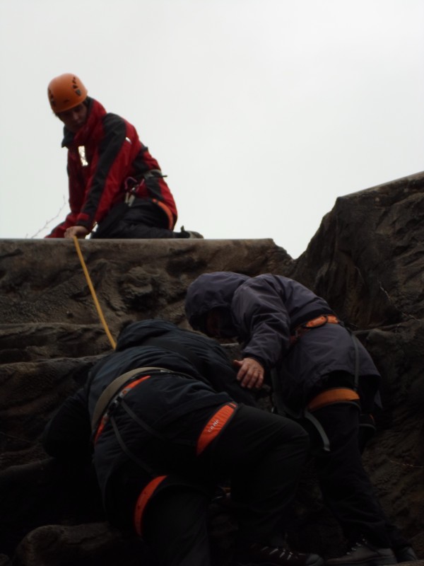 James rock climbing with Oli guiding the rope